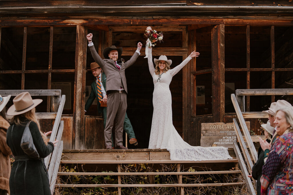 Bride and groom celebrating after their intimate Ashcroft Ghost town elopement ceremony in Aspen, Colorado