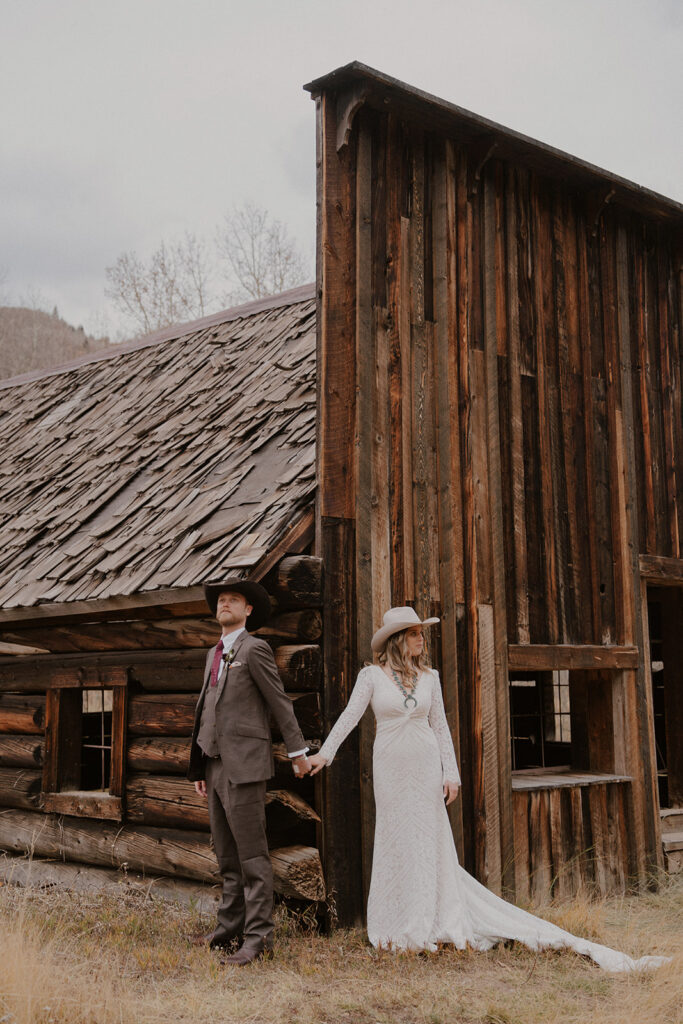 Couple posing for their Ashcroft Ghost Town elopement in Aspen, Colorado