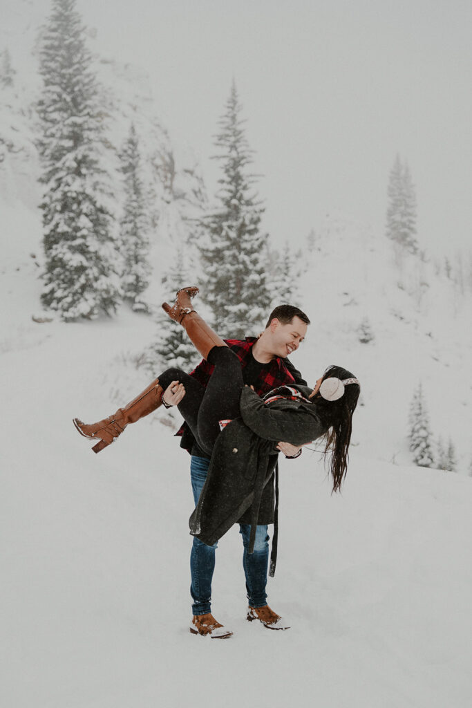 Couple posing during their snowy Colorado photoshoot for their Boreas Pass engagement