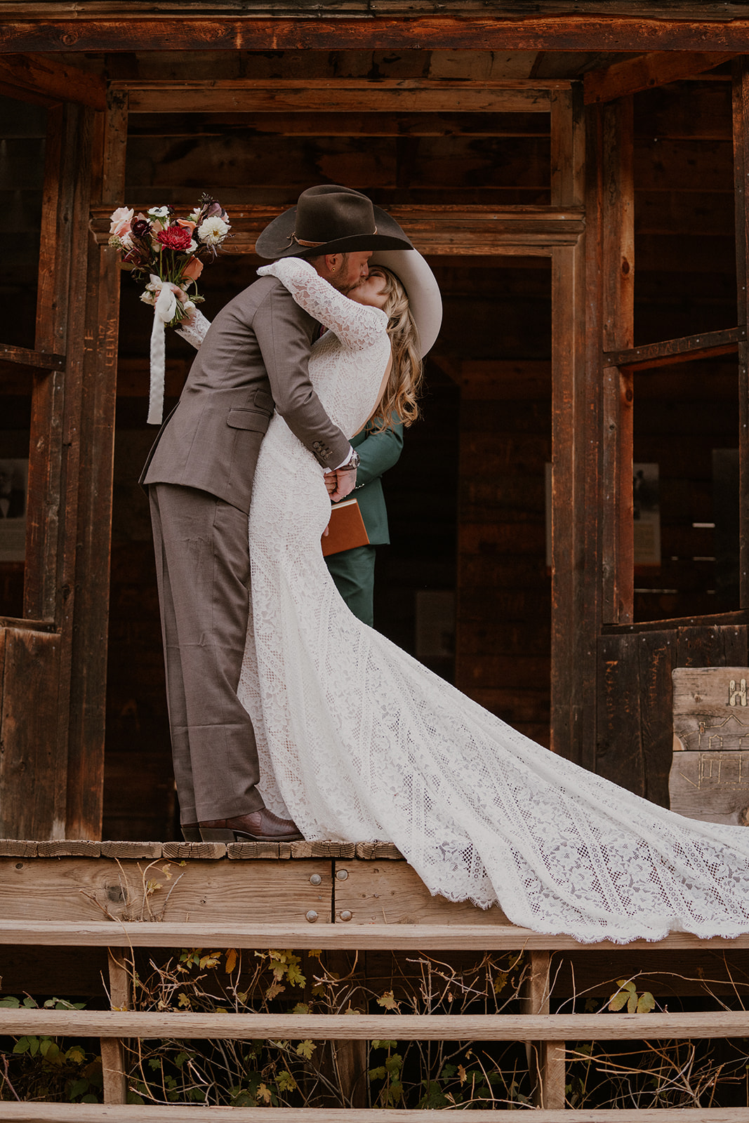 Bride and groom kissing during their intimate Ashcroft Ghost town elopement ceremony in Aspen, Colorado