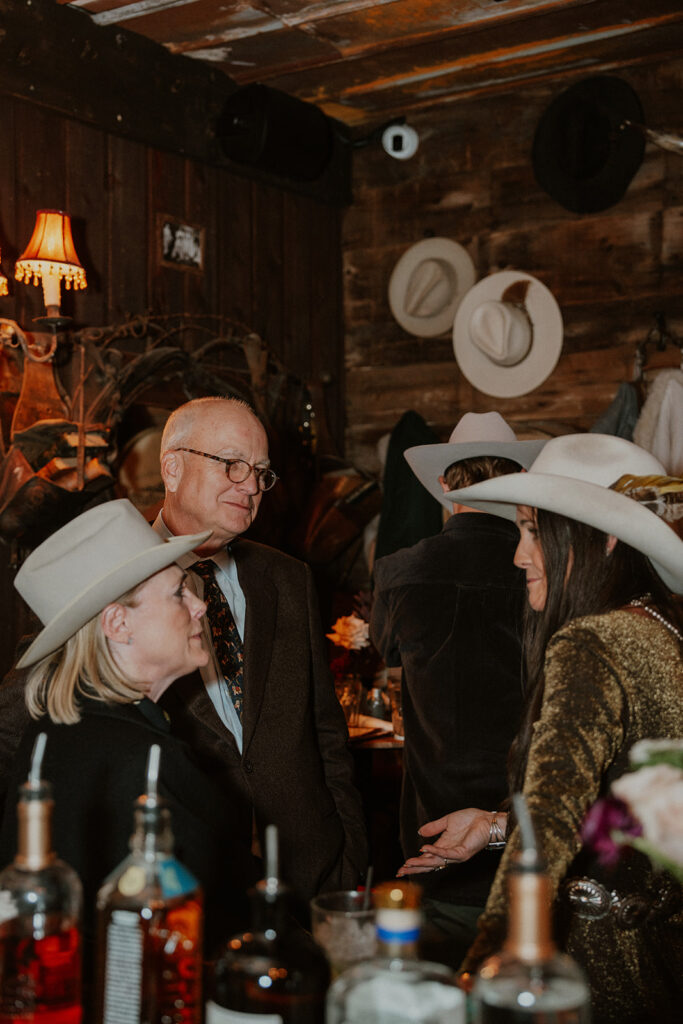 Guests mingling during an intimate reception at Woody Creek Tavern