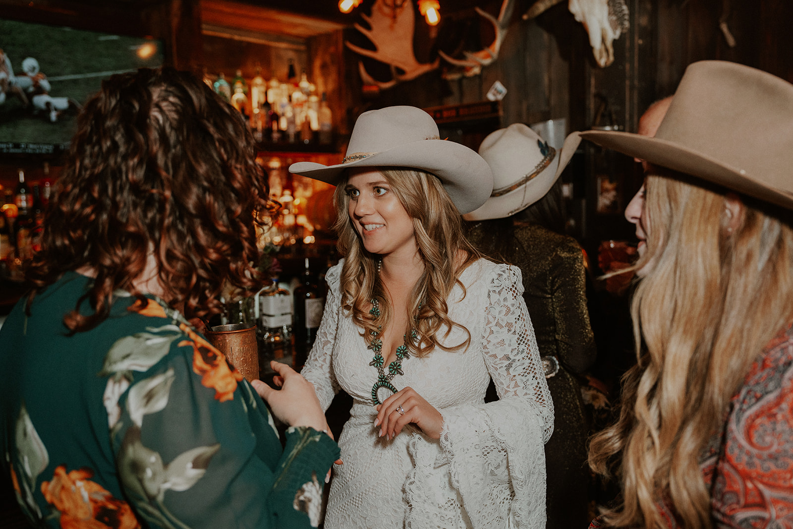 Bride mingling with guests during an intimate reception at Woody Creek Tavern